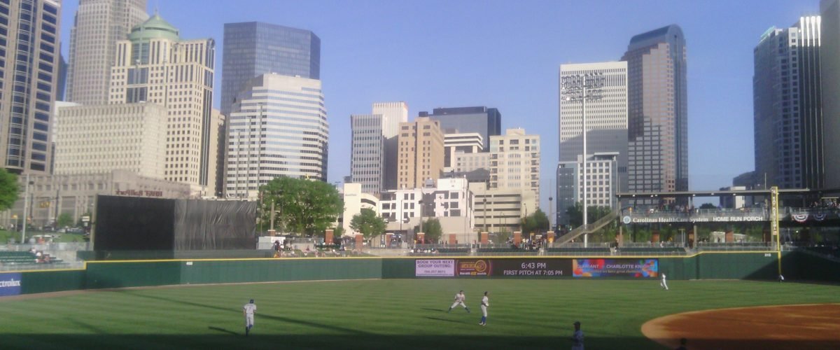 Truist Field baseball stadium with the Uptown Charlotte skyline rising behind it
